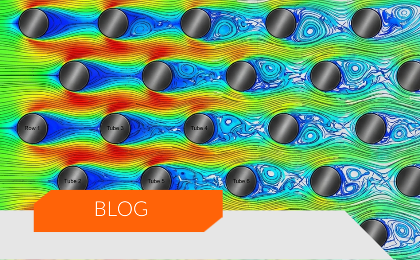 Simulação CFD do escoamento de ar em feixe tubo-aleta evidenciando perda de carga em trocadores de calor.